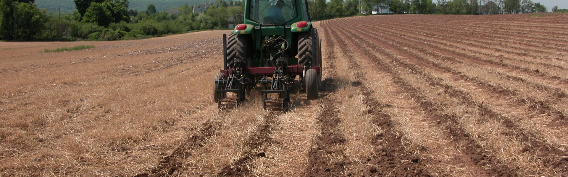 tractor with deep zone tillage machine in a field in Connecticut